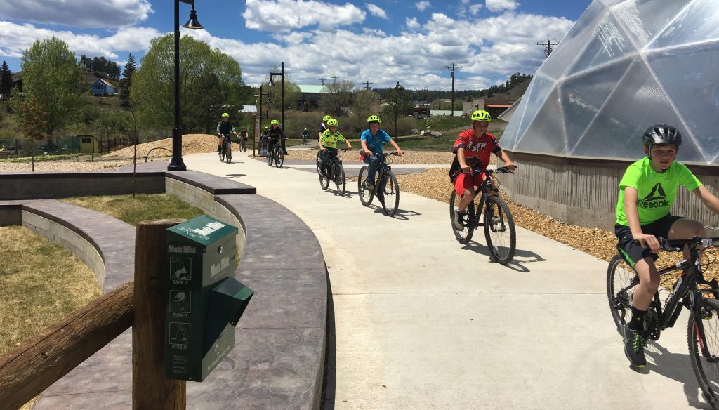  /> <span>Bicyclists along the San Juan River in downtown Pagosa Springs. (Staff photo)</span></p>
<p><span>Finally, the Colorado Department of Transportation is in the preliminary planning phases of a project to redesign portions of Highway 160, the major roadway running through downtown that acts as the area’s main street. The project represents an opportunity to slow traffic through downtown while improving the streetscape to make it safer and more attractive for residents and visitors to navigate on foot. The town has already budgeted for new pedestrian improvements to increase safety at key locations in downtown. Combined with a new scenic overlook structure above the river, the town hopes to entice drivers passing through to stop and stay a while.</span></p>
<p><span>The workshop helped Pagosa Springs identify redevelopment opportunities to focus on as catalysts for future projects, with an eye towards creating new housing and economic development opportunities. The </span><a href=