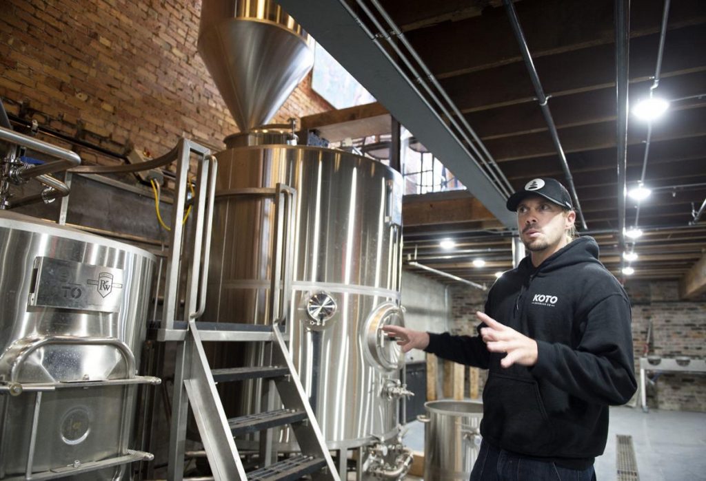  /> <span>Pierre Tusow of Koto Brewing Co. explains his five-barrel beer brewing system. (Image: <a href=