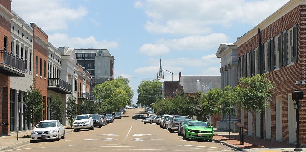  /><span>A view of downtown Natchez, Mississippi</span></p>
<p><strong>Natchez, Mississippi has never been connected to the interstate highway system. Today, with help from Smart Growth America, it is revitalizing its historic downtown and also working to connect to the rest of the world through a newer medium: high-speed, broadband internet. </strong></p>
<p>Natchez’ success has always been based on its connection to resources, commerce, and culture. The Natchez Trace—a historic forest trail connecting Natchez to Nashville—and the Mississippi River were important connections for Natchez to the outside world. And while Natchez has not been connected to the interstate highway system to date, there is a new “highway” that is arguably more important for the city’s future: high-speed broadband internet.</p>
<p>After watching a webinar showcasing our <a href=