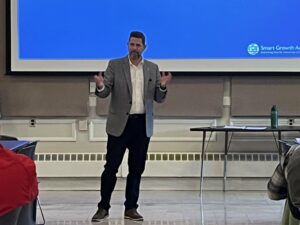 Mayor Jeff Caggiano of Bristol Connecticut standing to give remarks