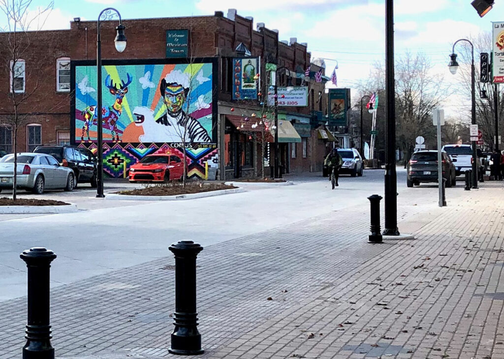 Cyclist travels down the updated Bagley Street, which includes space for drivers and pedestrians.
